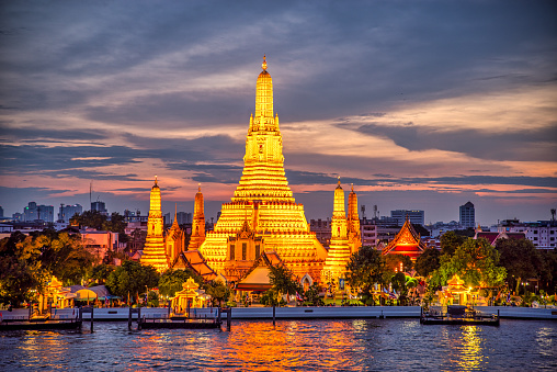 blue hour at Wat Arun temple and Chao Phraya River, Bangkok. Thailand